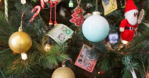 Christmas tree with cash as decors - Managing cashflow - Advivo blog image